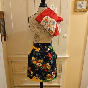 Two vintage brightly colored aprons *
